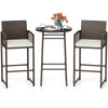 Bar height table and two ergonomic armchairs in PE wicker with soft cushions, perfect for outdoor patio relaxation.