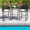 Bar height table and two armchairs with white cushions, made of PE wicker, perfect for poolside relaxation.