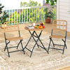 Folding round table and two chairs with handwoven rattan seats, perfect for outdoor patio dining and relaxation.
