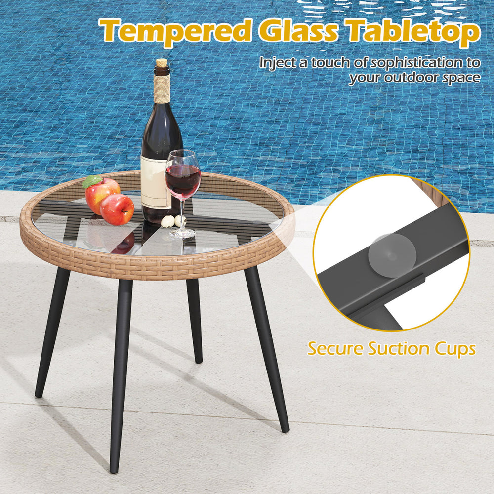 Round coffee table with tempered glass top and PE rattan base, featuring secure suction cups for outdoor use.