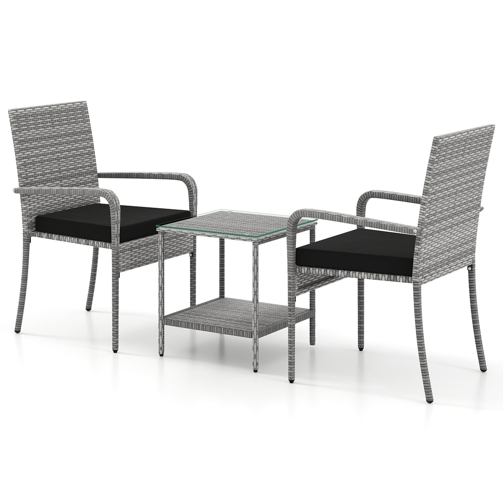 Two chairs with black cushions and a tempered glass tabletop in a 3-piece patio furniture set for balcony use.
