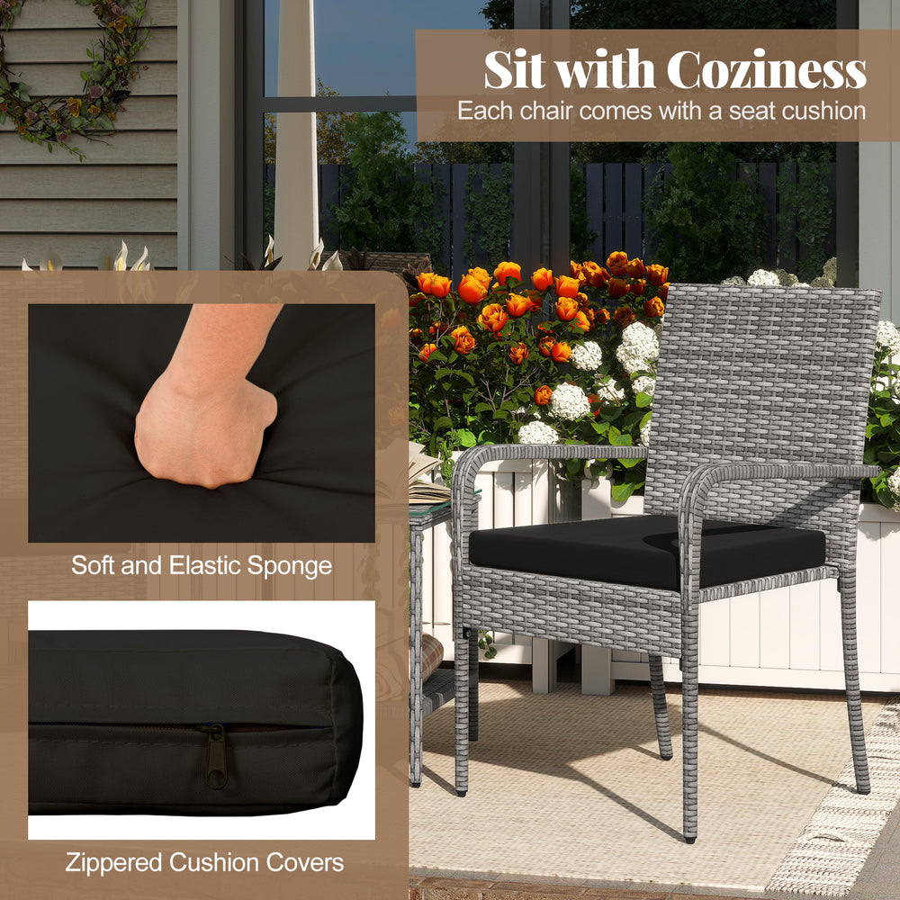 Black patio chair with soft seat cushion, ergonomic design, and durable PE rattan for cozy outdoor relaxation.