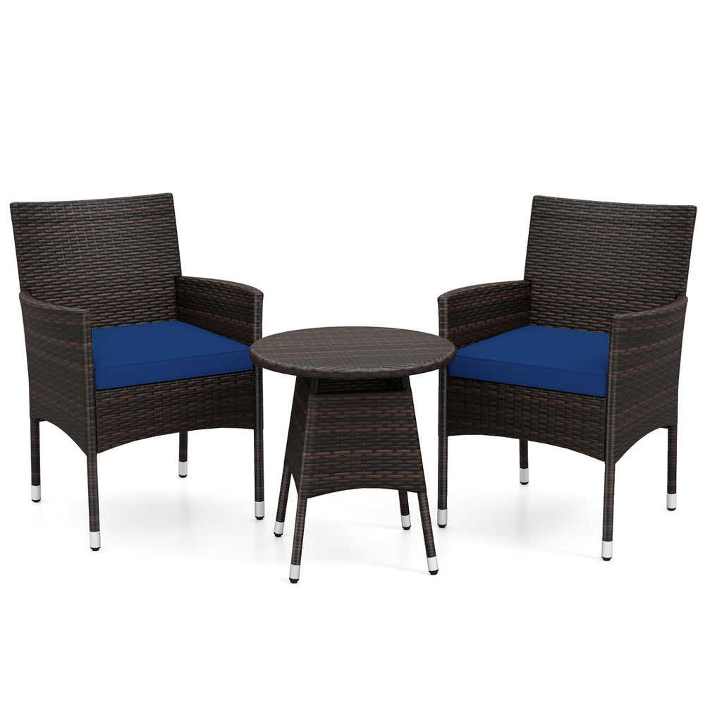 Two navy cushion chairs and a round table in a 3-piece patio furniture set made of brown PE rattan for outdoor.