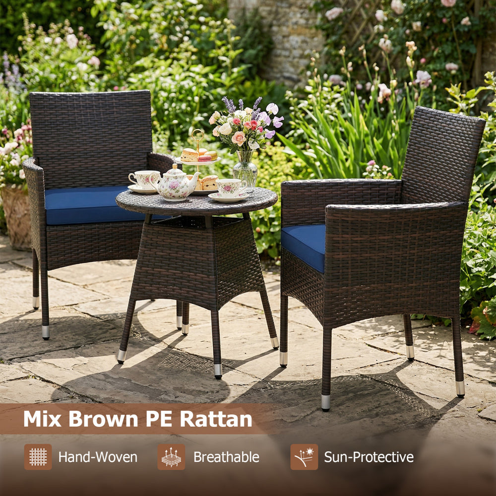 Two chairs and a round table in mix brown PE rattan, perfect for outdoor patio relaxation with navy cushions.
