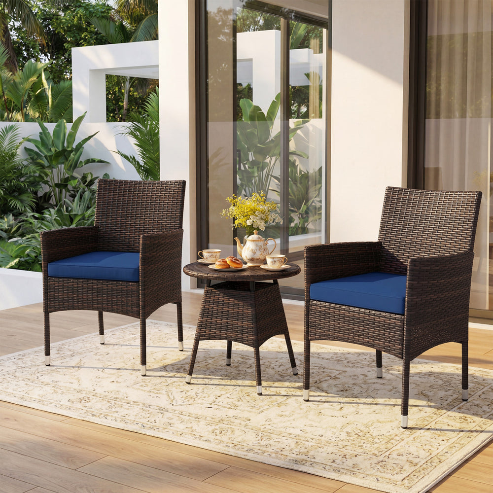 Two navy cushion patio chairs with a round table, crafted from brown PE rattan, perfect for outdoor relaxation.