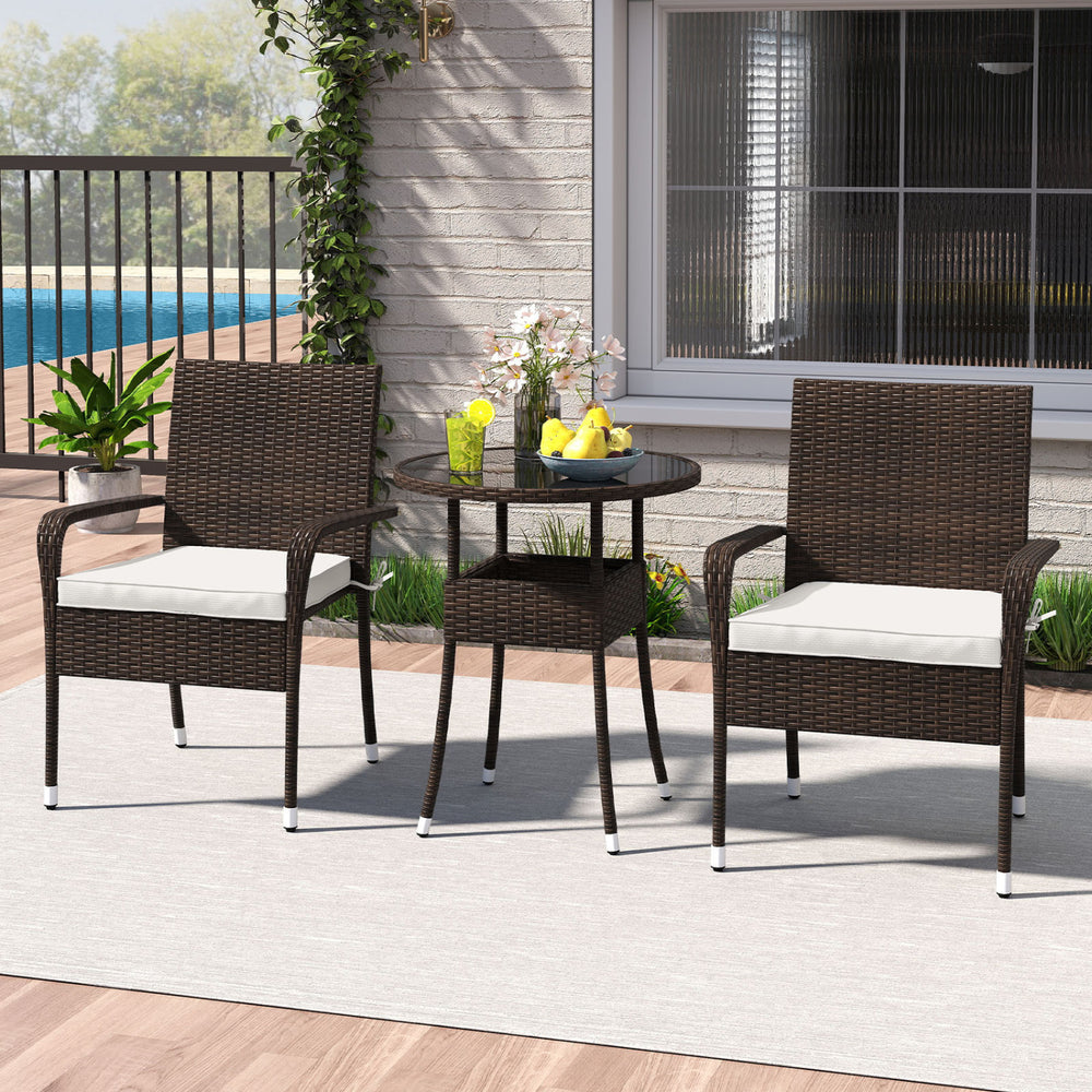 Side view of a 3-piece patio furniture set with two PE rattan wicker chairs and a tempered glass top table, designed.