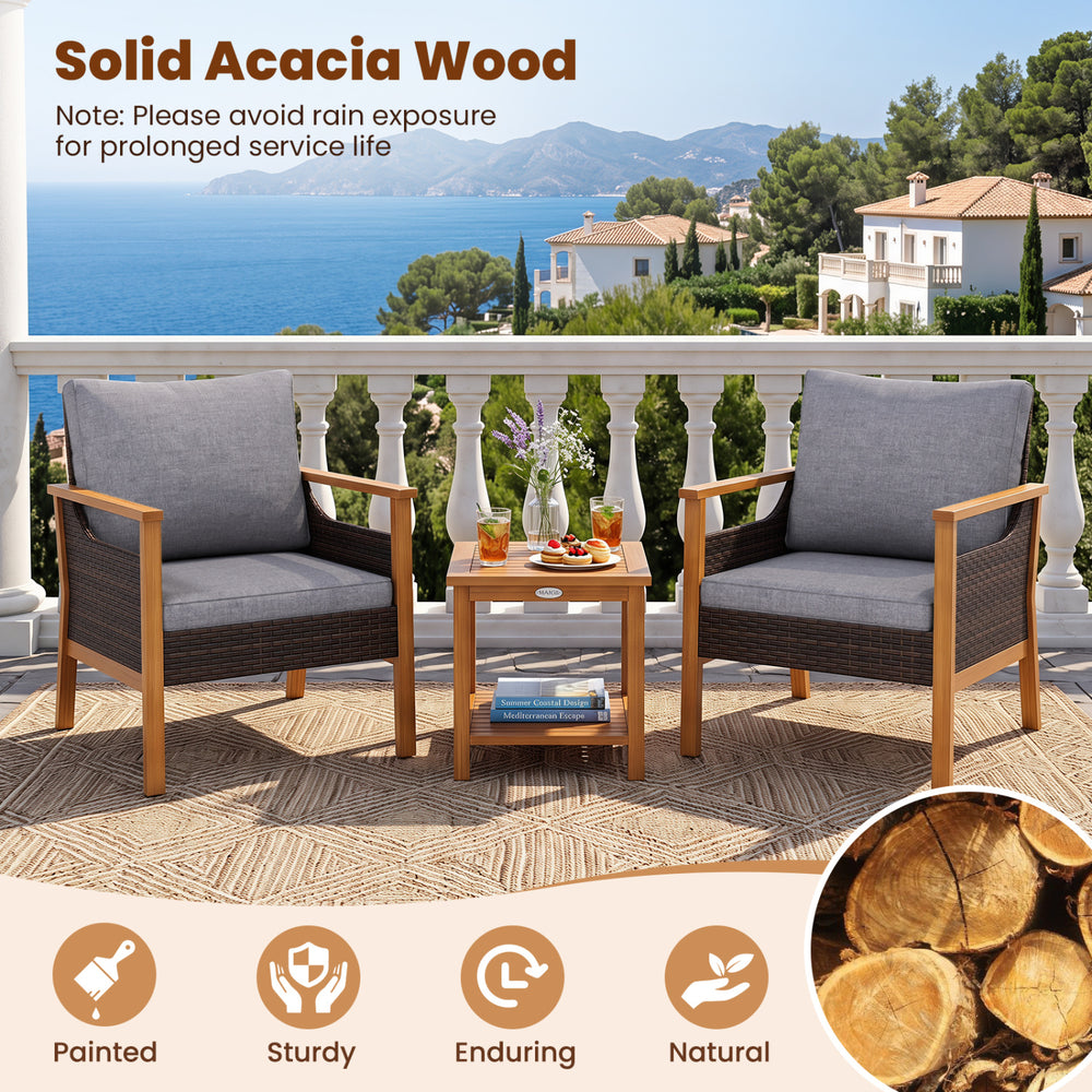 Two gray cushioned chairs made of painted solid acacia wood with a slatted side table, ideal for outdoor relaxation.