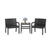 Two black rattan armchairs and a square side table, perfect for outdoor patio use and stylish relaxation.