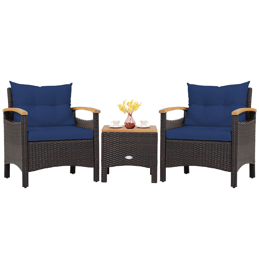 Two navy blue cushioned patio chairs with a brown PE rattan frame and acacia wood tabletop, ideal for outdoor.