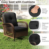 Cozy patio swivel rocker with thick black cushions, crafted from woven rattan, ideal for backyard relaxation.