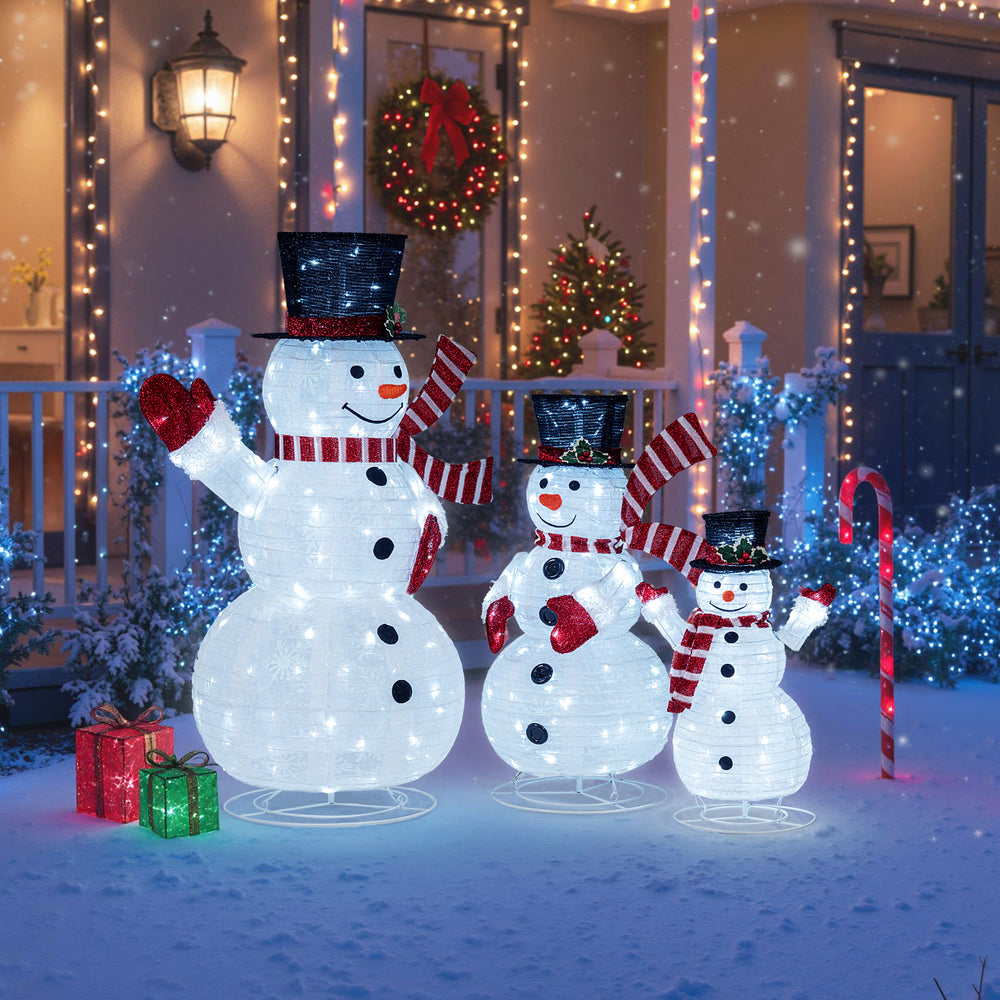 Three-piece pre-lit snowman set with 270 LED lights, featuring top hats, scarves, and a sturdy metal frame for outdoor.