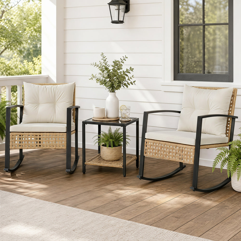 Comfortable rocking chair featuring thick white cushions and premium PE rattan, ideal for serene outdoor lounging.
