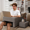 Extra large gray lap desk with ergonomic reading pillow and cup holders, perfect for working or relaxing on the couch.