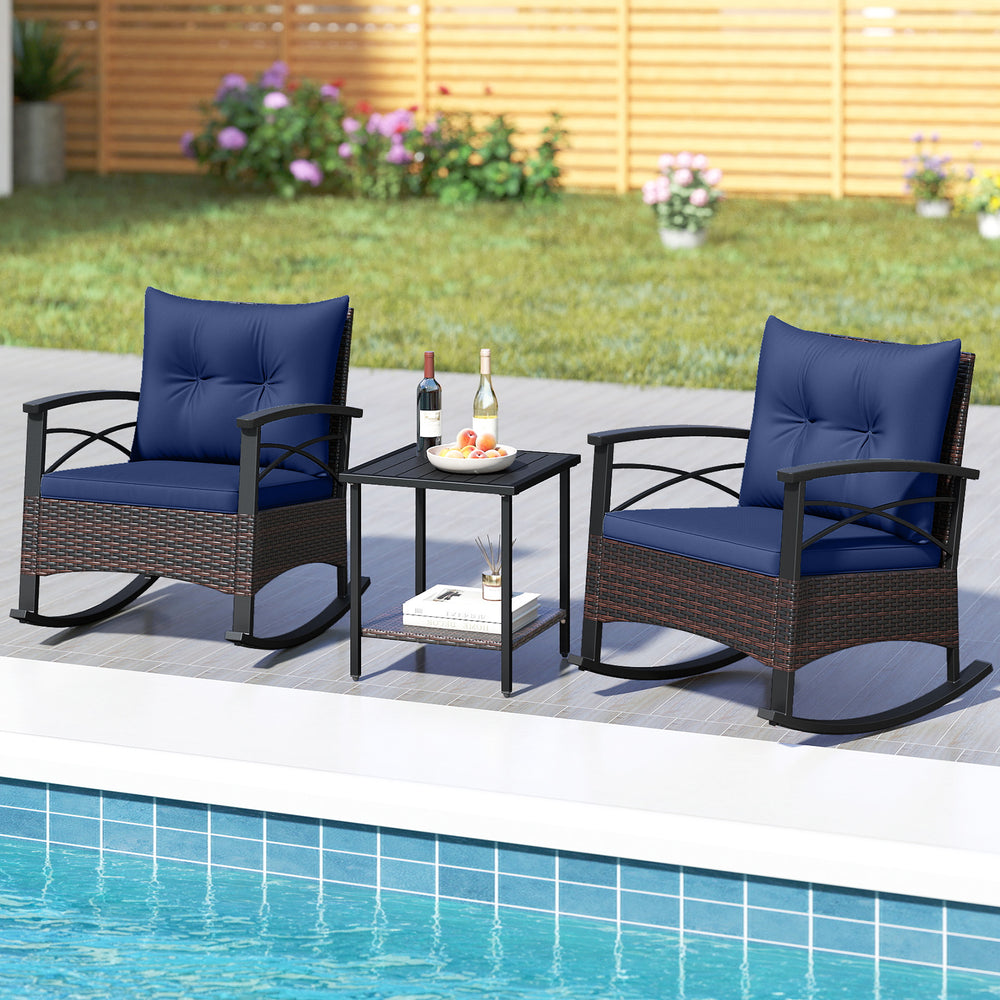 Navy blue rocking chairs with PE rattan and acacia wood table, perfect for outdoor relaxation by the poolside.