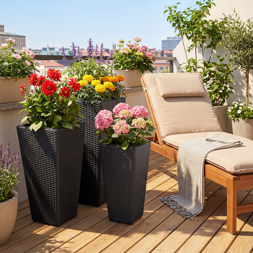 Tapered black wicker planters with vibrant flowers, perfect for balcony or garden decoration and space-saving stacking.