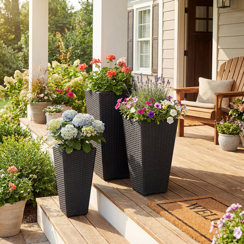 Tapered black wicker planters in three sizes with colorful flowers, perfect for enhancing your porch or garden.