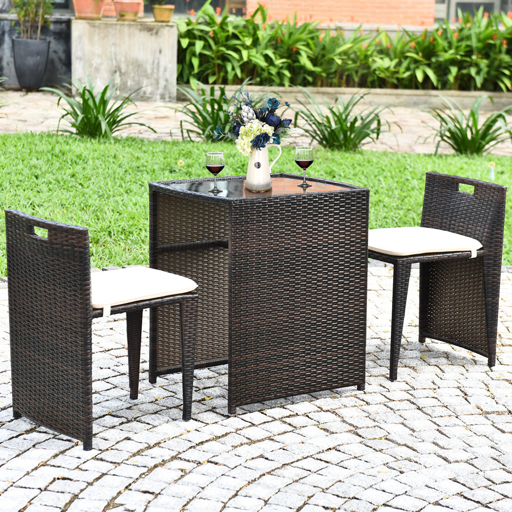 Cushioned wicker patio bistro set featuring a strong steel frame, ideal for outdoor relaxation on the patio or garden.