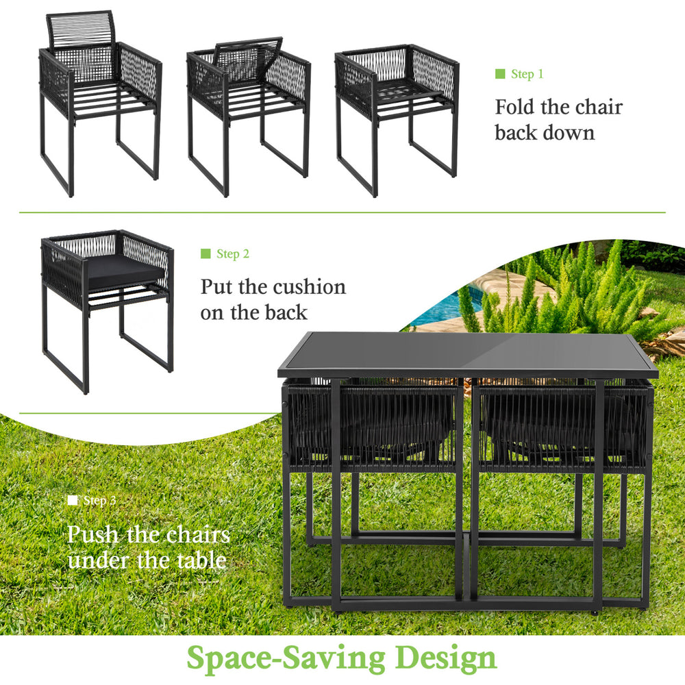 Folding outdoor dining set featuring black hand-woven PE rattan chairs with cushions, ideal for backyard or poolside.