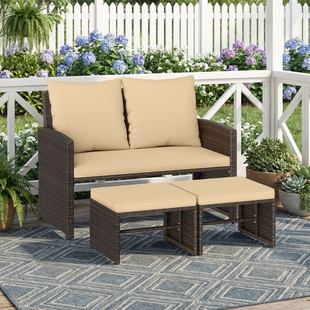 Outdoor patio PE wicker loveseat set with beige cushions and multifunctional ottomans for garden relaxation.