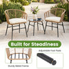 Two chairs with soft cushions and a round bistro table in a patio set, made of durable PE rattan and metal frame.