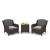 Two gray cushioned outdoor rattan chairs with a tempered glass coffee table, perfect for garden or balcony relaxation.
