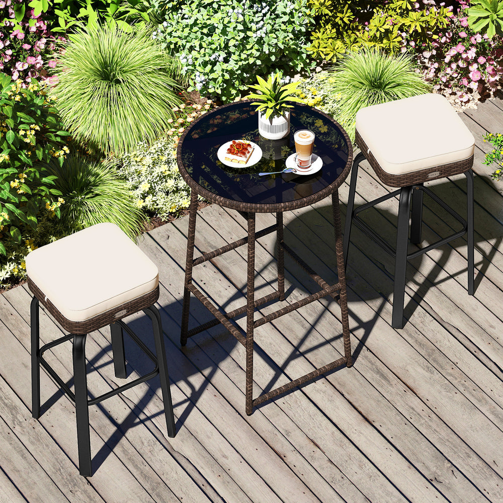 Outdoor swivel bar set featuring a PE rattan table and two cushioned chairs, perfect for patio relaxation.