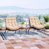 Two cushioned papasan chairs in beige with a side table, perfect for outdoor patio relaxation and stylish lounging.