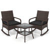 Two ergonomic armchairs with black cushions and a 2-tier side table in a PE wicker rocking bistro set for outdoor relaxation.
