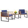 Two navy cushioned armchairs with acacia wood frames and a coffee table, perfect for outdoor patio conversation.