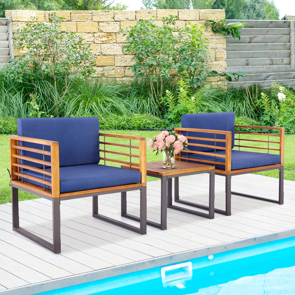 Two cushioned armchairs with acacia wood frames and a coffee table, perfect for outdoor patio relaxation.
