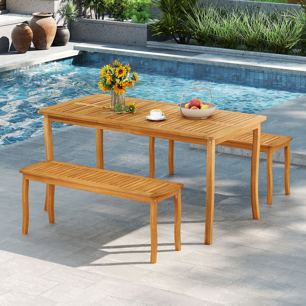Acacia wood patio dining set featuring a spacious table and two benches, perfect for outdoor gatherings by the pool.