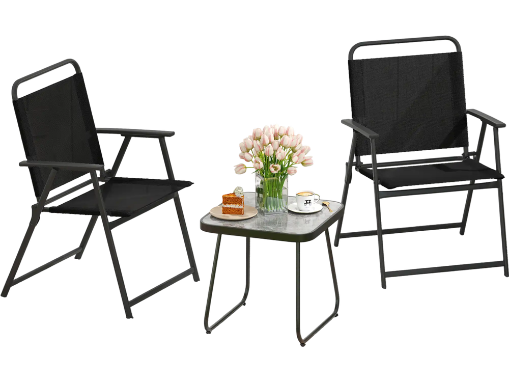Two black folding patio chairs with a side table, perfect for outdoor relaxation in a garden or on a porch.