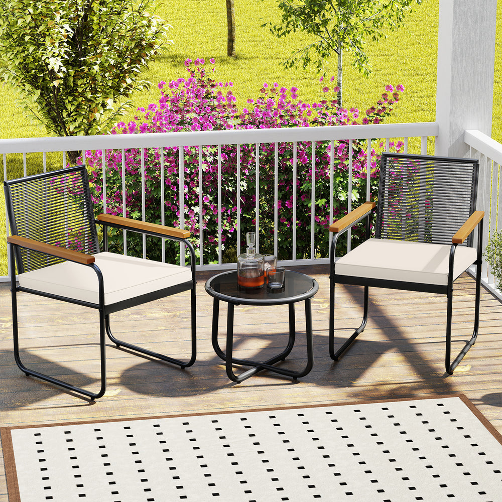 Two patio chairs with acacia wood armrests and a round tempered glass table, perfect for outdoor relaxation.