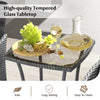 Tempered glass tabletop with a cheese platter and wine, part of a navy 3-piece patio furniture set for outdoor use.