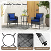 Cushioned patio chairs and tempered glass coffee table in navy, featuring durable PE rattan for outdoor use.