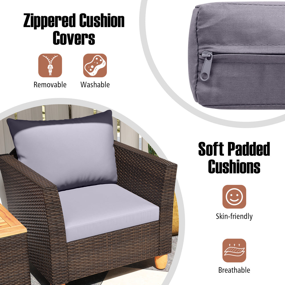 Close-up of soft padded cushions with zippered covers on a gray patio rattan chair, perfect for outdoor relaxation.