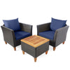 Two navy blue cushioned rattan chairs with a wooden table, perfect for outdoor patio or garden relaxation.