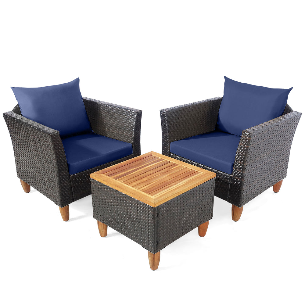 Two navy blue cushioned rattan chairs with a wooden table, perfect for outdoor patio or garden relaxation.