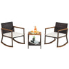 3-piece rattan rocking bistro set with off-white cushions and a double-tier coffee table for outdoor relaxation.