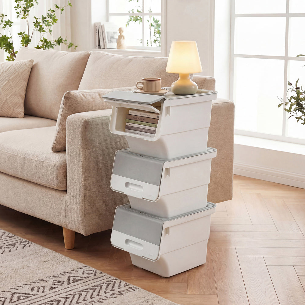 Stackable gray storage bins on wheels with stay-open lids, perfect for organizing kitchens and bedrooms.