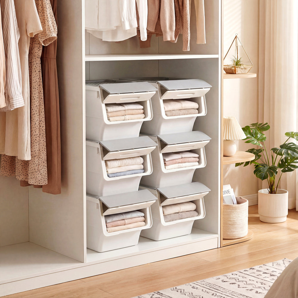 Stackable gray storage bins with stay-open lids, featuring wheels for easy mobility, ideal for organizing closets and.