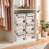Stackable gray storage bins with stay-open lids, featuring wheels for easy mobility, ideal for organizing closets and.