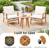 Two acacia wood chairs with off-white cushions and a matching side table, perfect for outdoor patio relaxation.