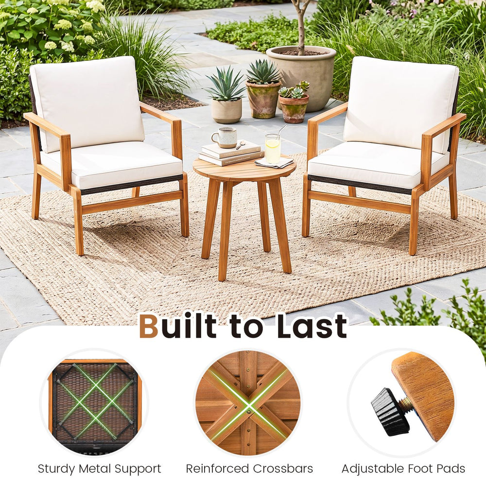 Two acacia wood chairs with off-white cushions and a matching side table, perfect for outdoor patio relaxation.