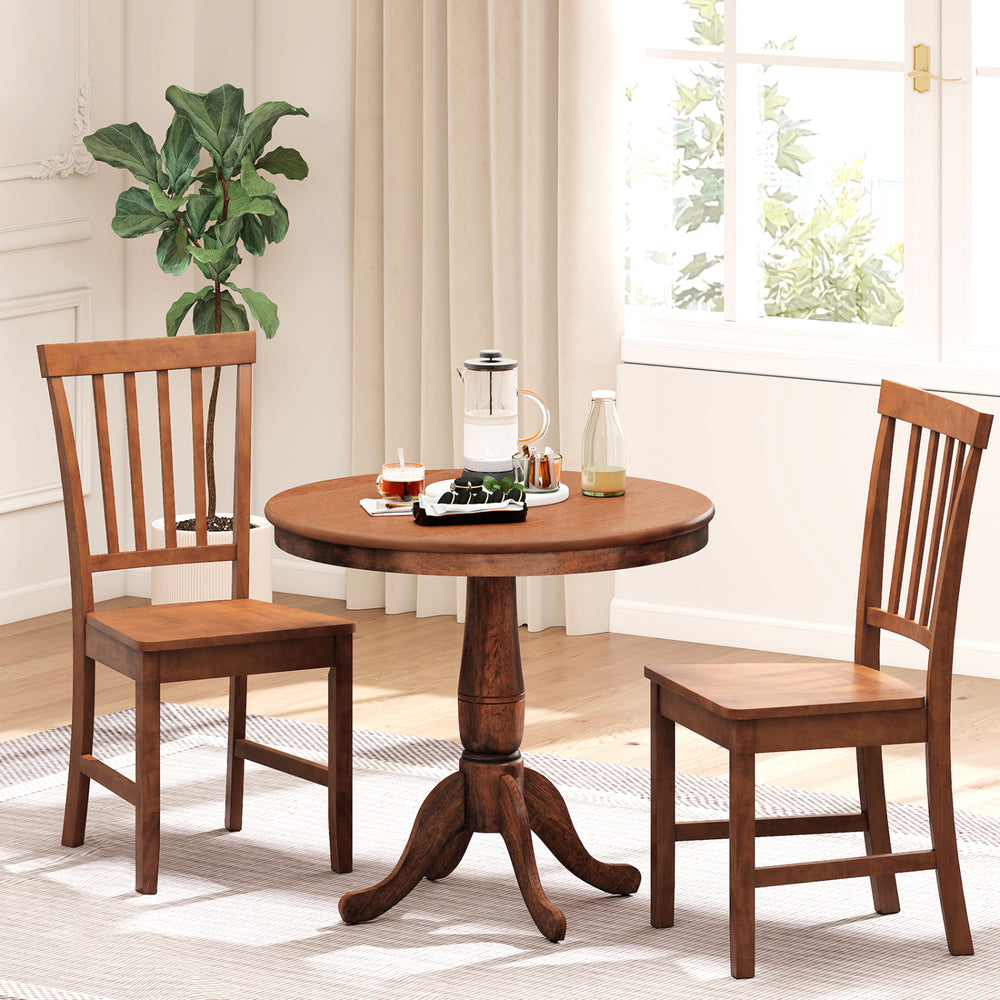 Round wooden dining table with two chairs, made of solid rubber wood, perfect for kitchen or cafe settings.