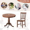 Round wooden dining table with solid rubber wood legs and ergonomic chair, ideal for cafes and kitchens.