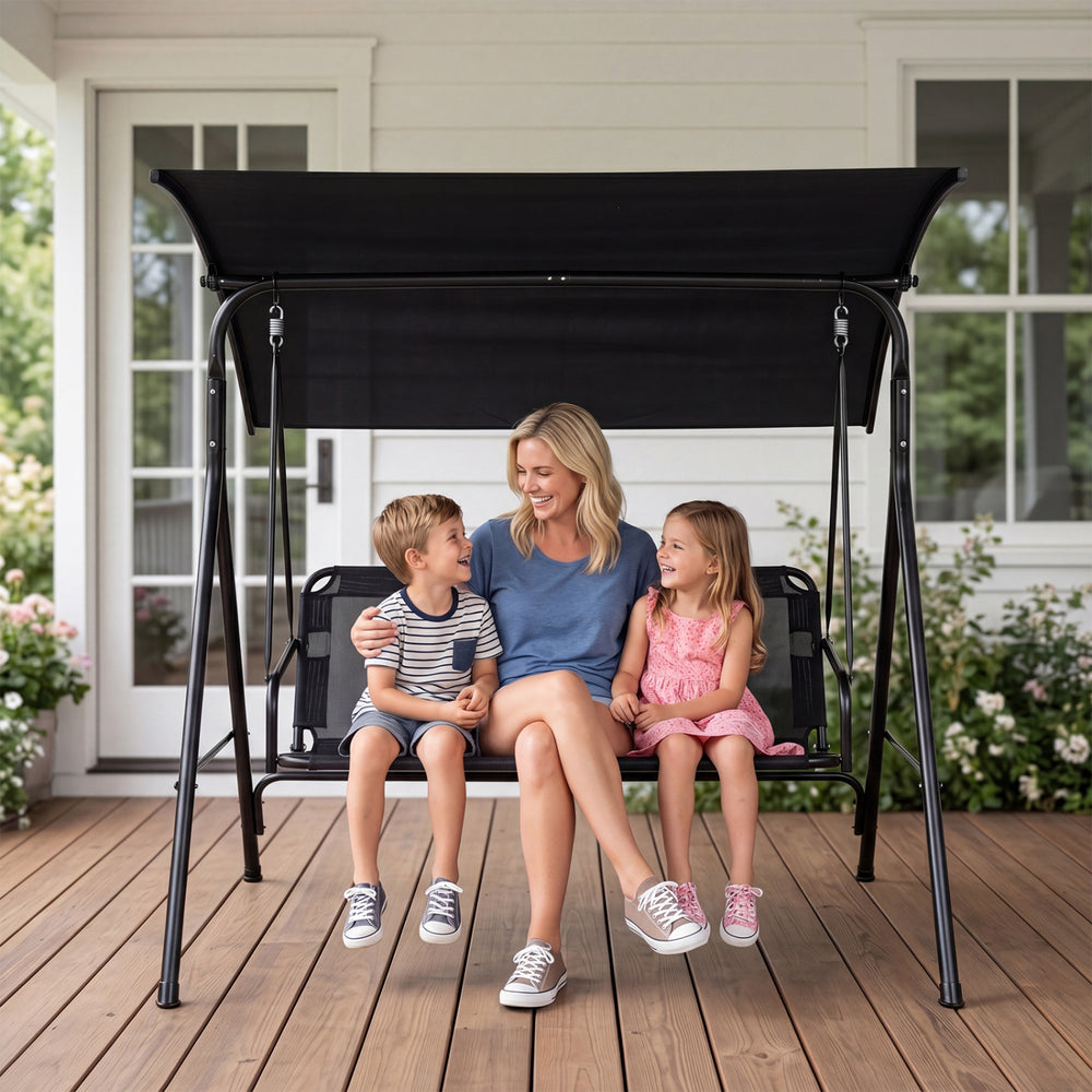 Three-seat patio swing chair on a deck, featuring a sun-protective adjustable canopy and breathable mesh for relaxation.