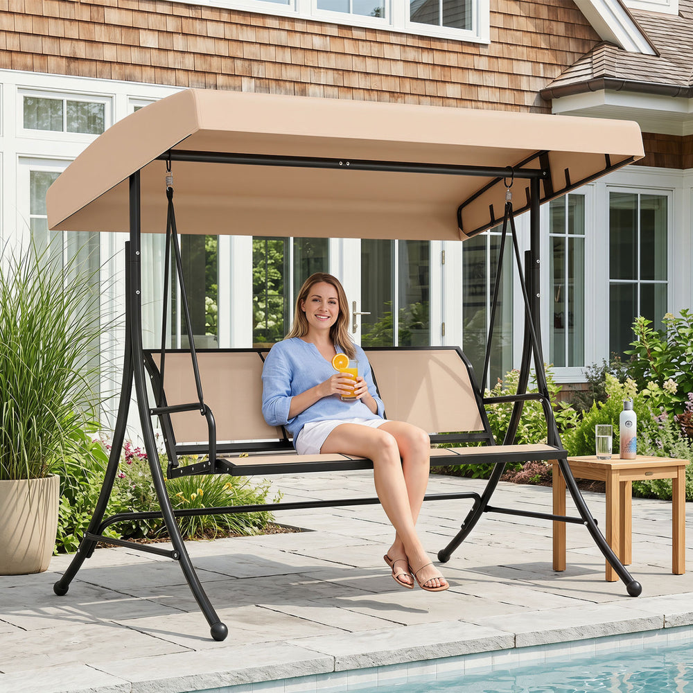 3-seat patio swing chair with adjustable canopy in black, perfect for outdoor relaxation by the pool.