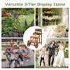 3-Tier carbonized fir wood plant display stand in brown with wheels and chalkboard, perfect for gardens and events.