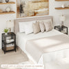 3-tier end table with wheels, featuring open storage shelves, styled in a modern bedroom setting.